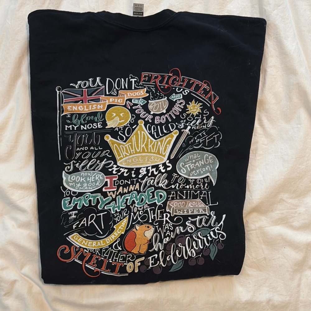 Black Graphic T-Shirt with Colorful Text Design